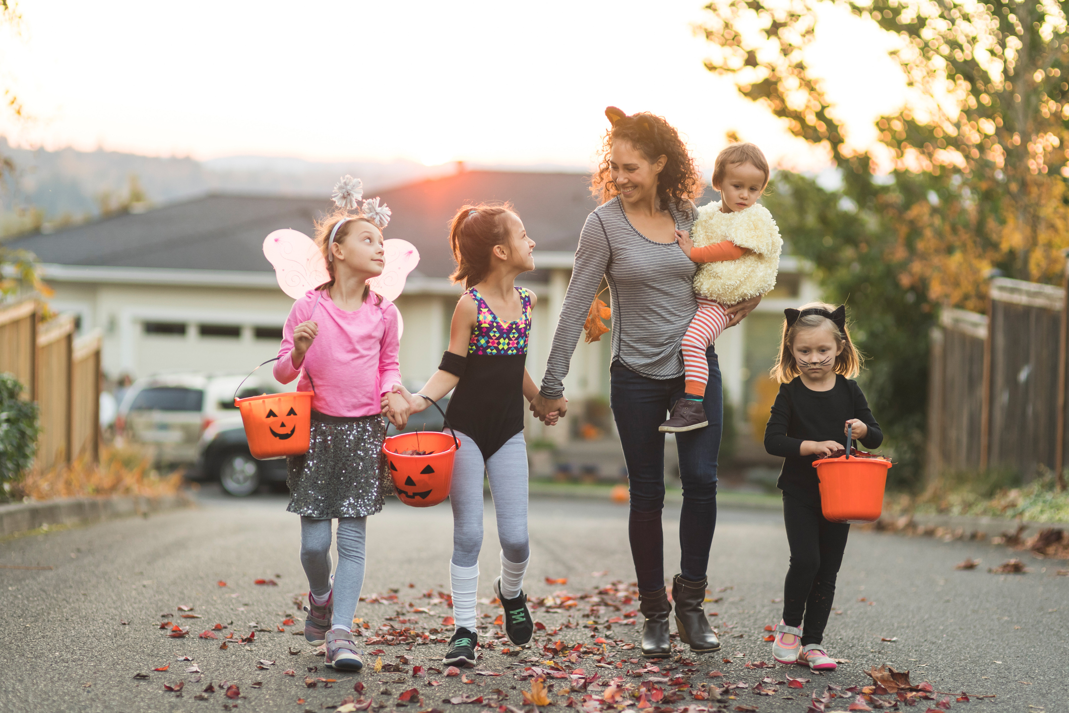 Family trick-or-treating outside