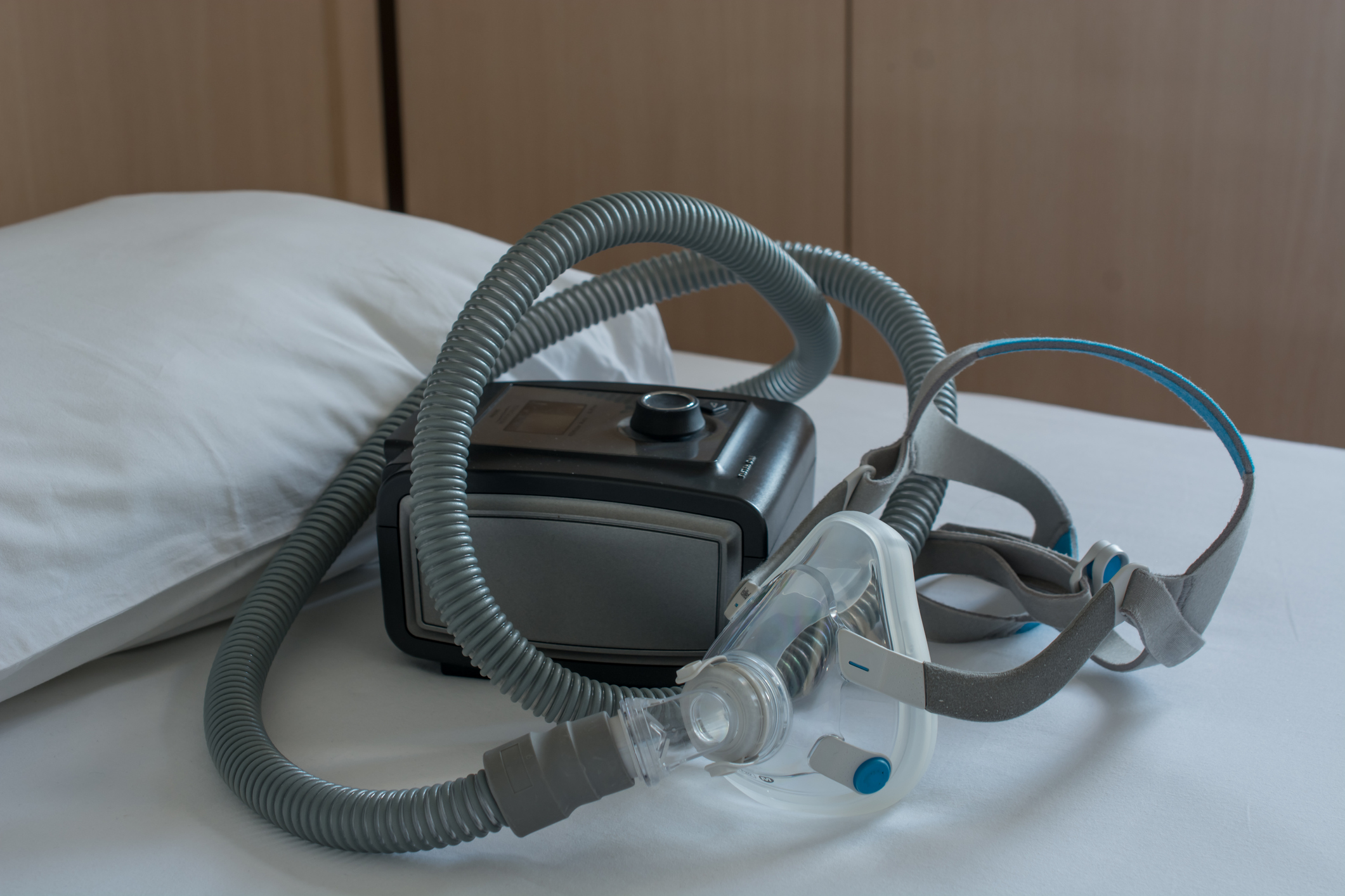 Unused CPAP machine on bed