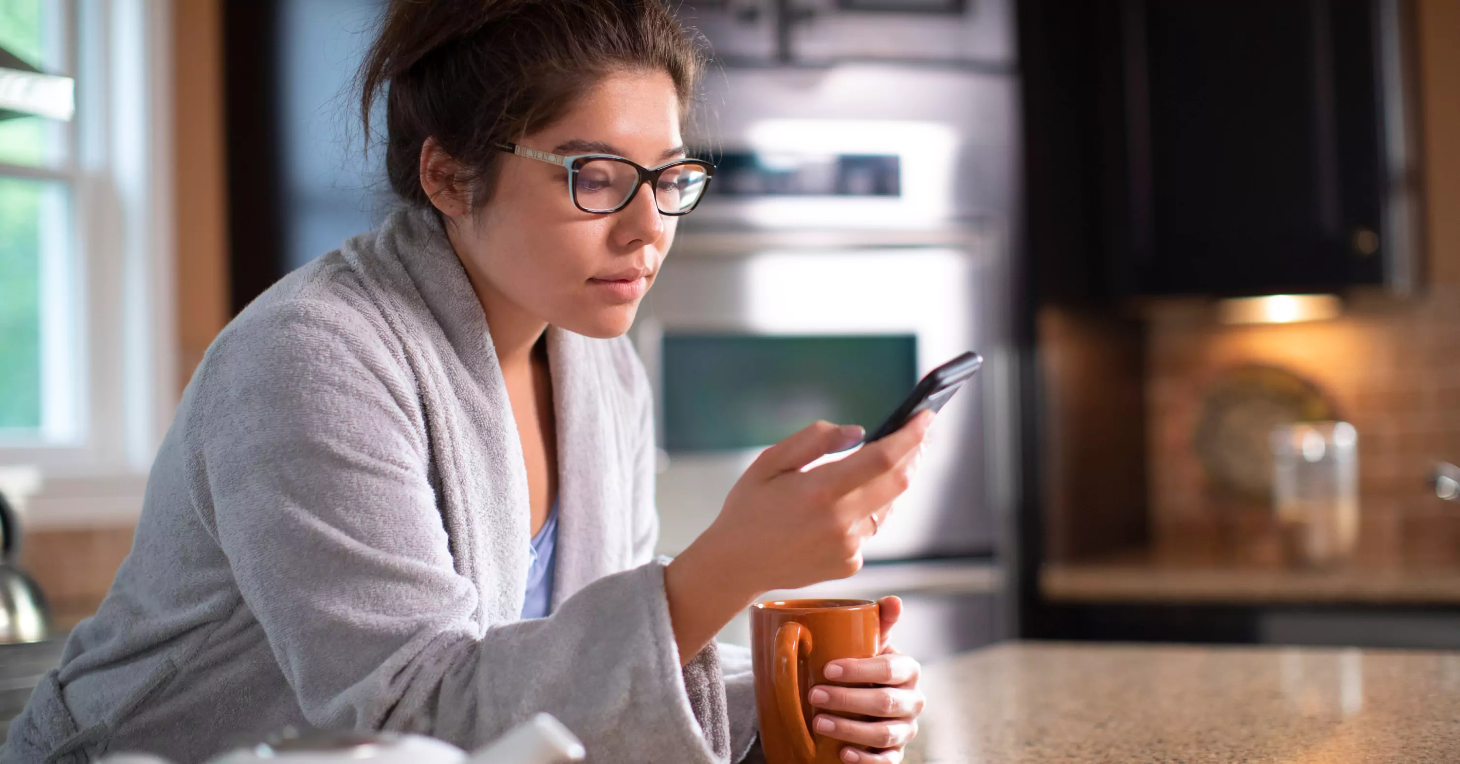 Sick woman looking at St. Luke's eCare on her phone.