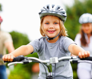 Little Girl Riding A Bike