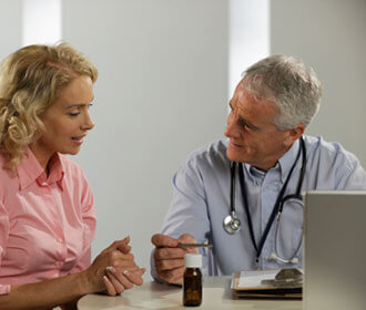 Woman Speaking with Her Doctor