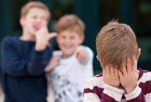 A Boy Covering His Face