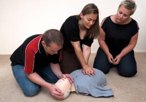 Class Learning to do CPR on a dummy 