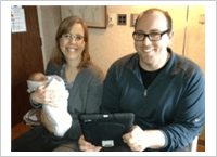 Couple holding their newborn baby