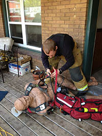 Fire Fighter Practicing First Aid on a Manikins