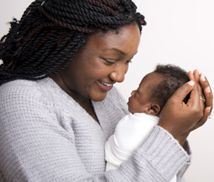 A mom looking at her baby who was recently born at St. Luke's.