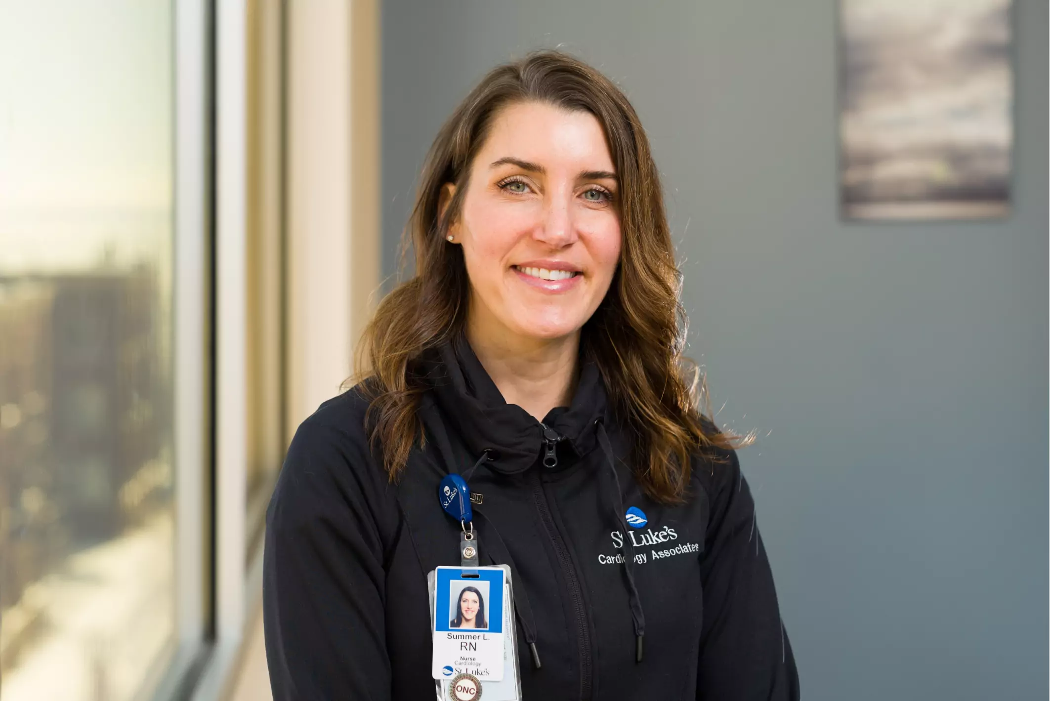 Summer, RN smiling in St. Luke's Cardiolody Associates Clinic.