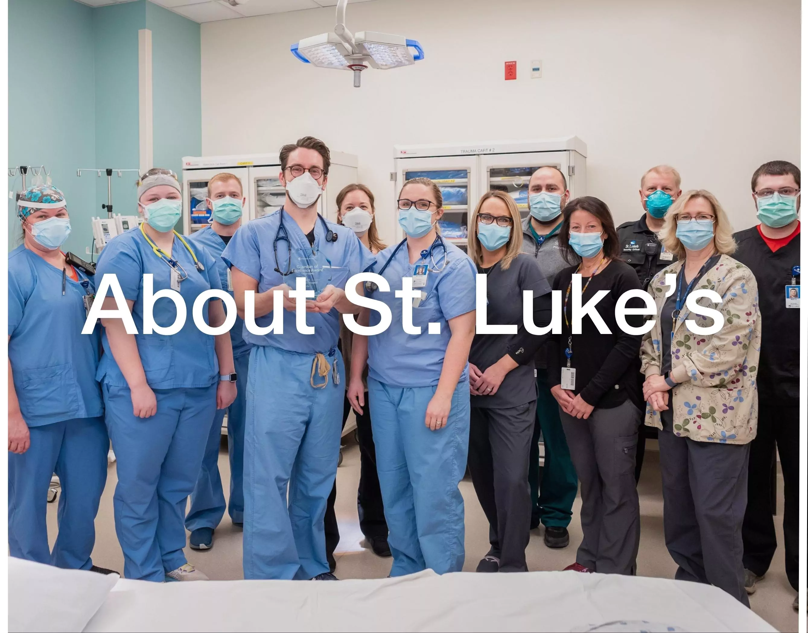 St. Luke's team smiling at St. Luke's Emergency Department with white text that says About St. Luke's