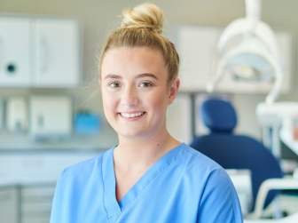 A student in scrubs.