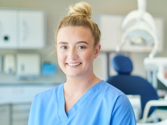 A student in scrubs.